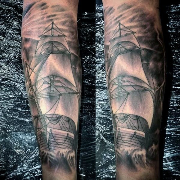 Black and grey calf tattoo of a ghostly sailing ship in a stormy sea, with dramatic shading and a misty, moonlit background