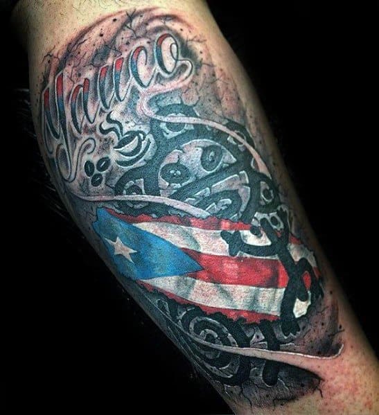 Puerto Rican flag tattoo with Taíno symbols and "Yauco" script, blending cultural heritage, pride, and ancestral roots in a bold design.