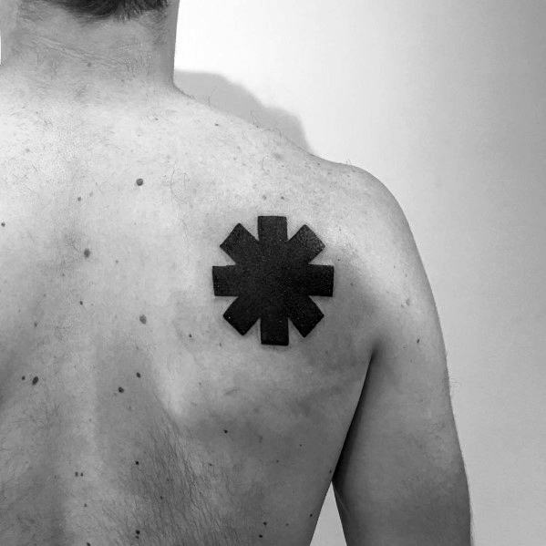 Minimalist upper back tattoo featuring the Red Hot Chili Peppers logo in solid black, creating a bold and simple statement.