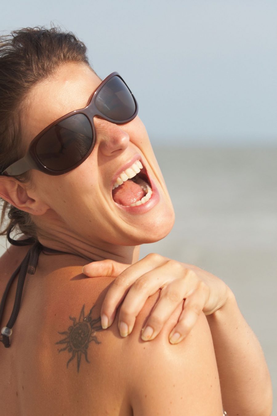 Tattooed Woman With Sunburn