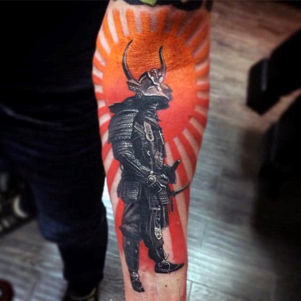 Tattoo of a samurai in black armor with a red and orange background on a person's forearm