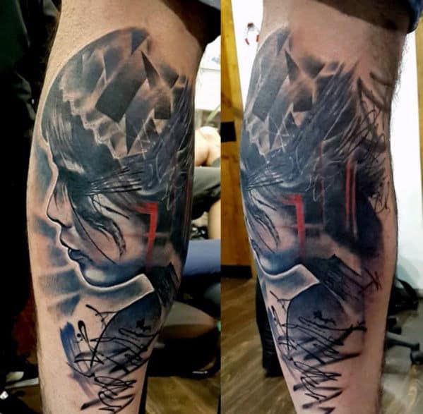 A detailed tattoo of a woman's face in grayscale on a person's calf