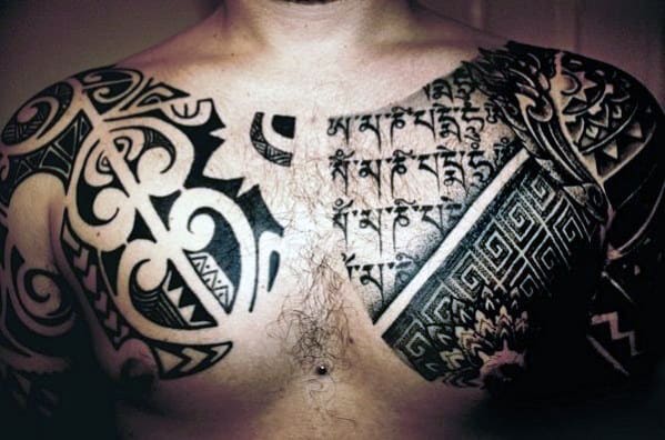 Intricate black tattoos covering chest and shoulders