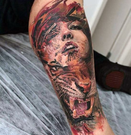 Tattoo of a woman's face blending into a roaring tiger on an arm