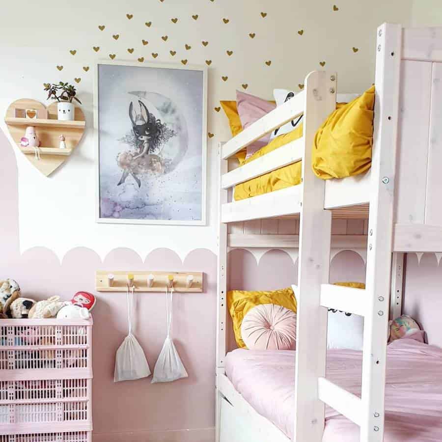 Cozy children's room with a bunk bed, pink decor, toys, wall art, and a heart-shaped shelf