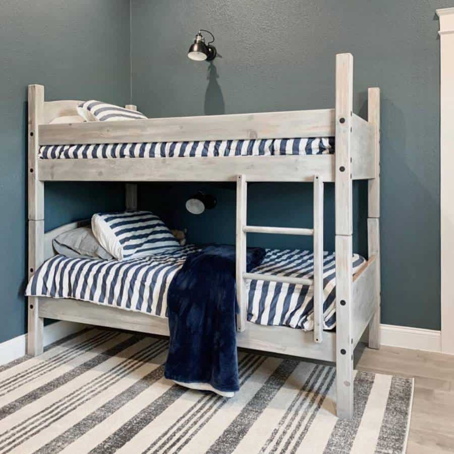 wood frame bunk bed blue accent wall