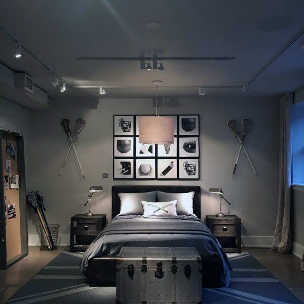 Gray sports-themed bedroom with lacrosse wall decor and framed artwork.