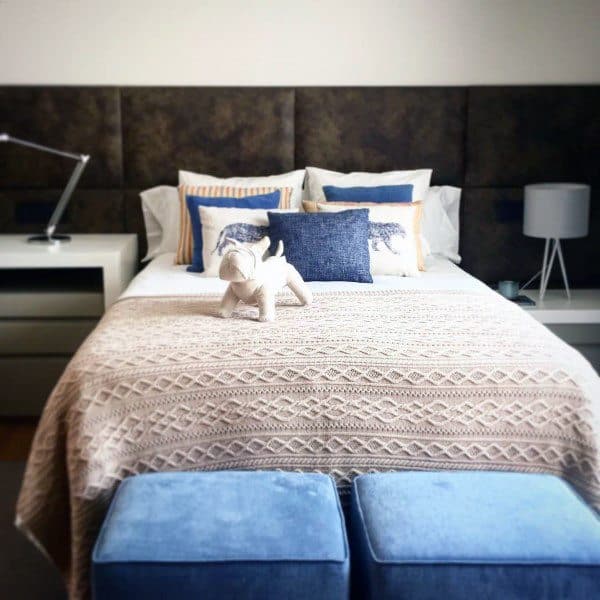 small bedroom blue bed seats bulldog toy