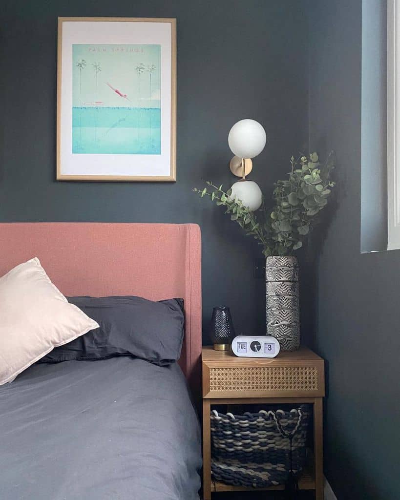 gray bedroom wall pink bed frame wood bedside table framed art