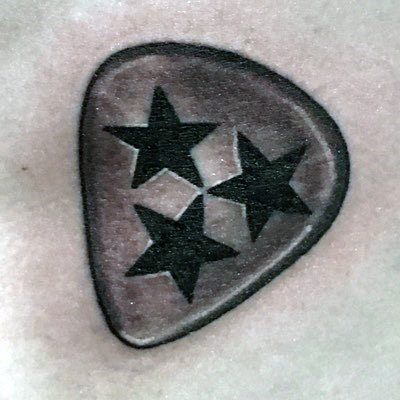Tennessee three-star emblem tattoo inside a guitar pick shape, symbolizing state pride and a love for music in a unique design.