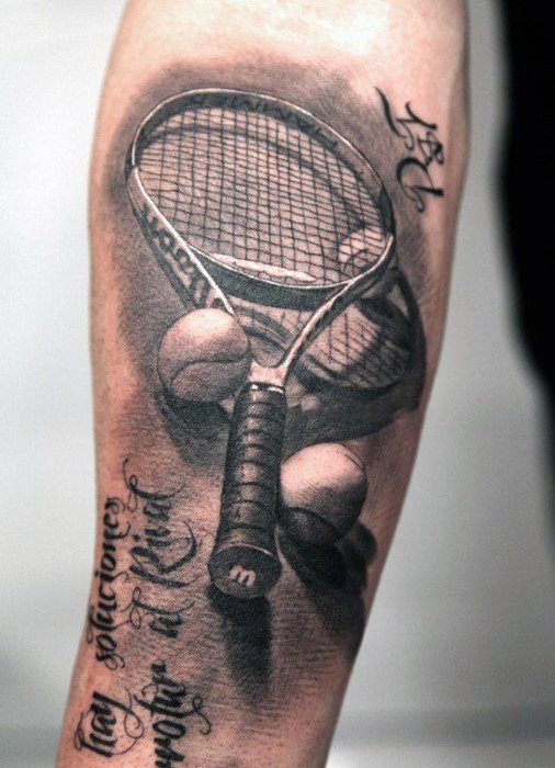 Realistic black and grey tattoo of a tennis racket with multiple tennis balls, accented by elegant script text for a personal and sporty tribute