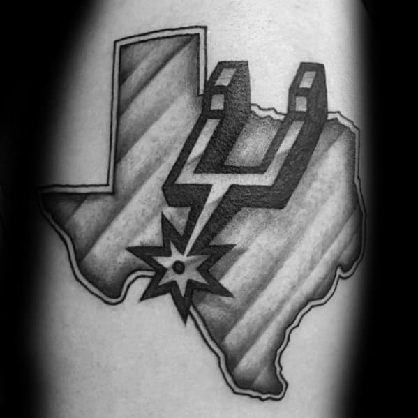 San Antonio Spurs logo tattoo over a shaded outline of Texas, blending team pride with state representation in bold black and gray ink.