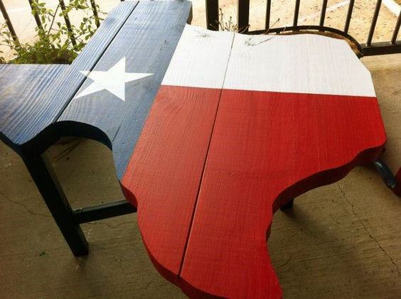 A table shaped like Texas painted with the Texas flag design