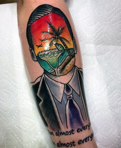 Color tattoo of a faceless Michael Scott from *The Office*, with a tropical beach scene inside his head, referencing his "Cafe Disco" or dream of escaping work.