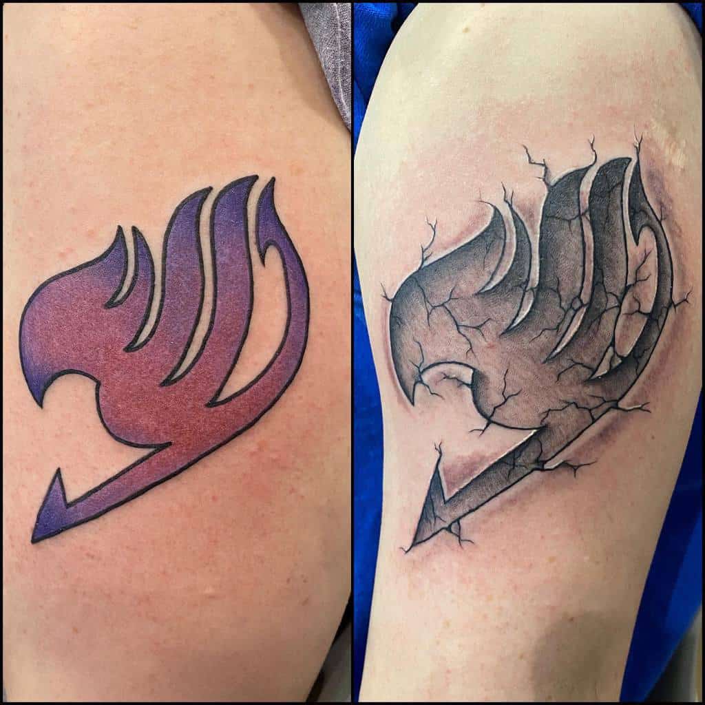 Two variations of the Fairy Tail guild emblem tattoo: one with a clean, smooth gradient design and the other featuring a cracked, stone-like texture for a battle-worn effect.