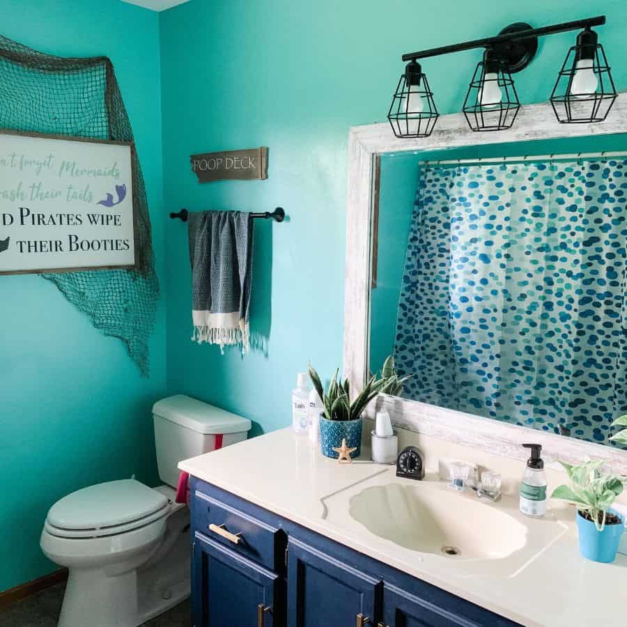 blue wall and vanity bathroom track lighting blue shower curtain