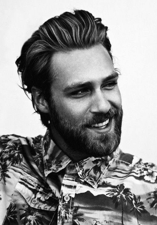 Medium-length tousled style with a beard