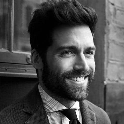 Classic voluminous quiff with a full beard