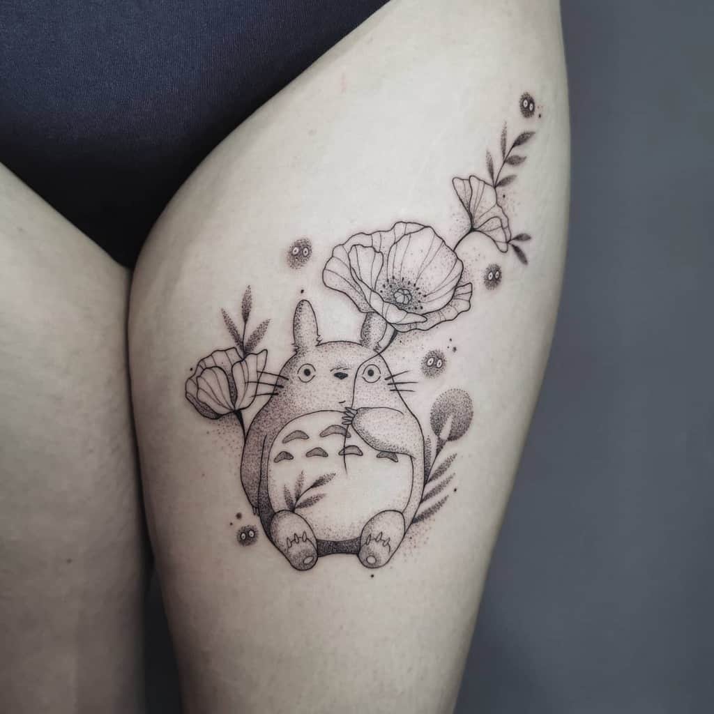 Tattoo of a Totoro with flowers and leaves on a thigh