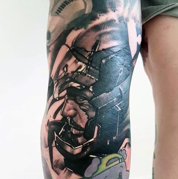 Iron Man tattoo in black and gray, featuring a close-up of his helmet with intricate shading and dramatic detail, capturing the powerful expression and futuristic design of his armor.