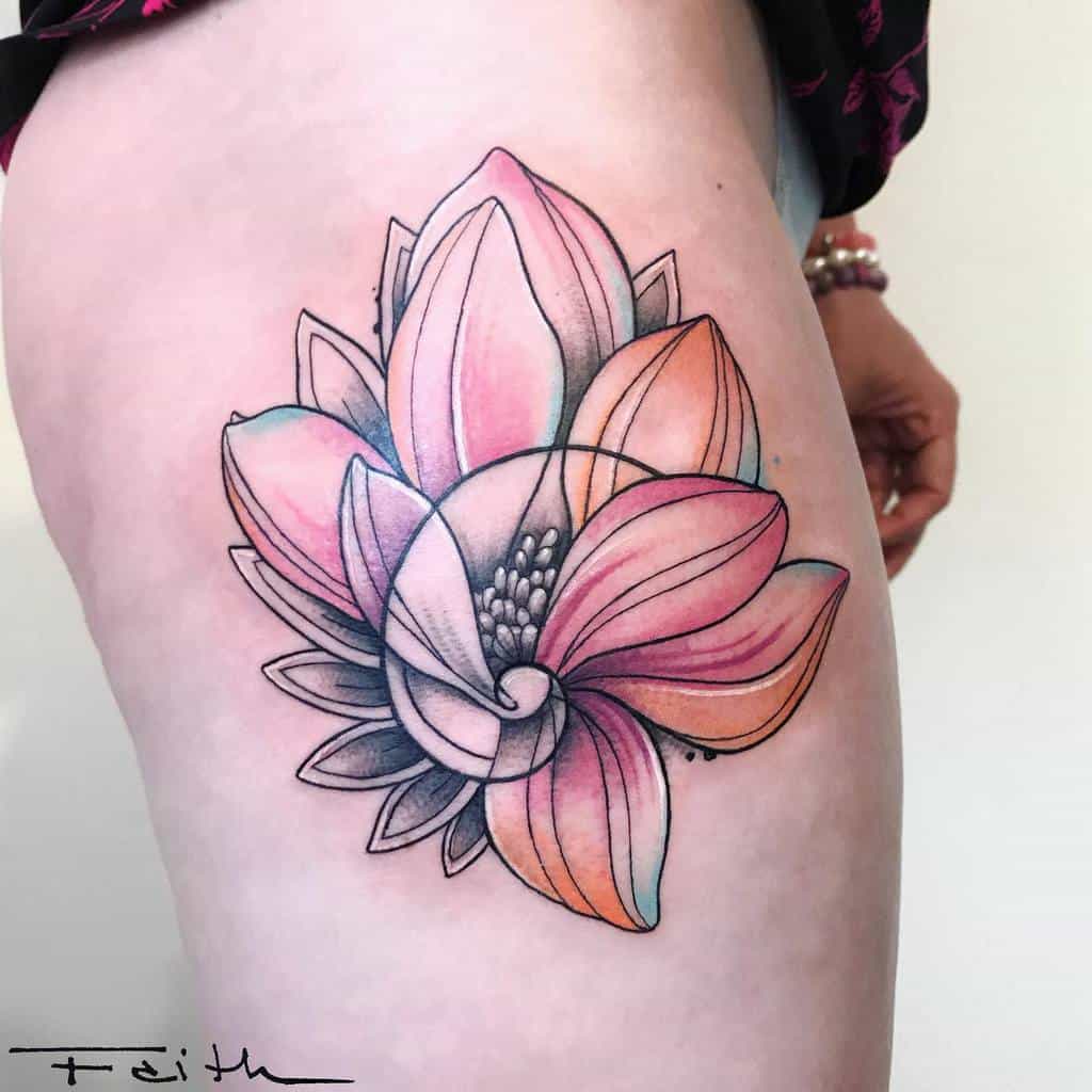 Tattoo of a colorful, stylized magnolia flower gracing a woman's thigh