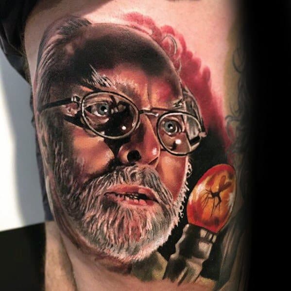 Thigh Male 3d Realistic Tattoo With Jurassic Park John Hammond Portrait Design
