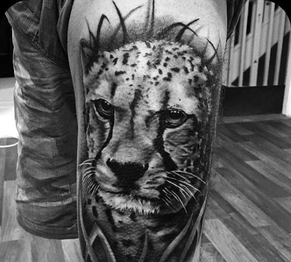 Thigh Male Cheetah In Grass Tattoo With Black And Grey Ink Design