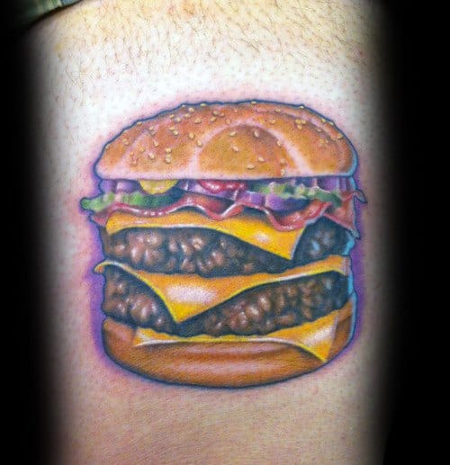 Cheeseburger tattoo design featuring double patties, melted cheese, lettuce, bacon, and sesame seed bun