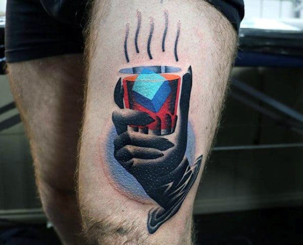 Surreal tattoo of a stylized hand holding a steaming geometric cup with bold red, blue, and purple shapes, blending realism and abstraction.