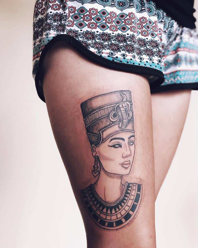 Tattoo of an ancient Egyptian queen on a woman's thigh