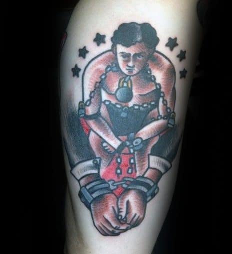Traditional tattoo of an escape artist in chains and cuffs, surrounded by stars on an arm
