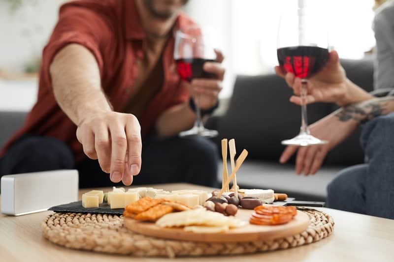 throw a wine and cheese party rainy day date ideas