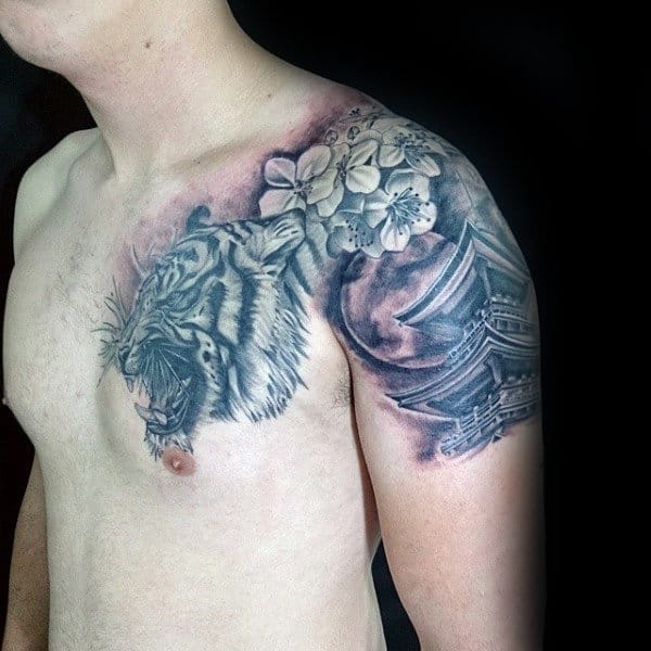 Black and grey shoulder tattoo featuring a roaring tiger, cherry blossoms, and a Japanese temple for a bold and symbolic design