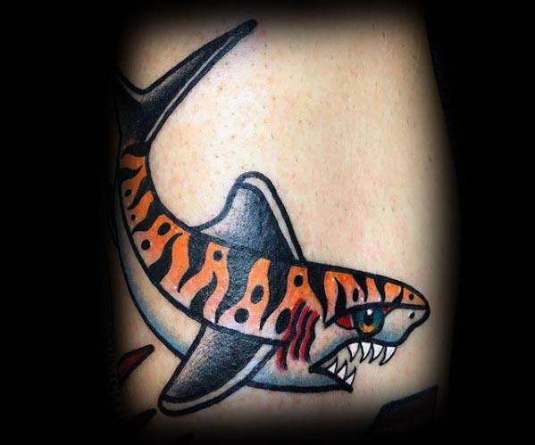 Traditional tiger shark tattoo with bright orange stripes, sharp teeth, red gill slashes, and a bold black outline for a classic look.