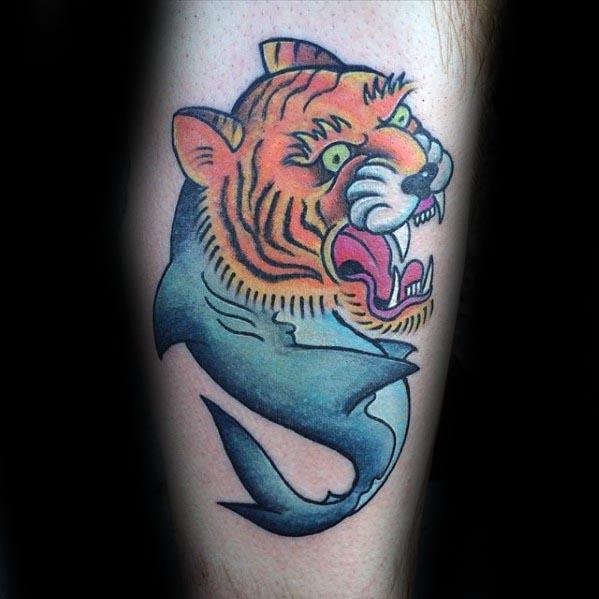 Bold tiger shark hybrid tattoo with a roaring tiger head and smooth blue shark body, blending power and grace in a traditional style.