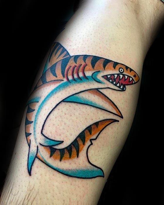 Clean and colorful tiger shark tattoo with bold black outlines, orange and blue tones, and a dynamic circular swimming pose.