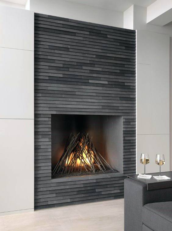 A contemporary fireplace with sleek gray tile detailing, blending modern design with minimalist aesthetics.
