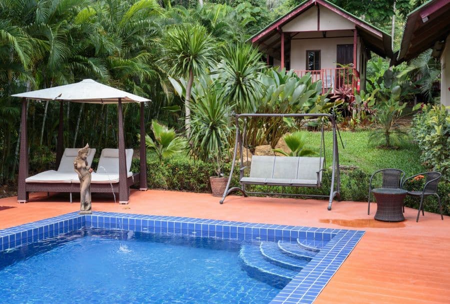 wood deck pool patio with swing seating
