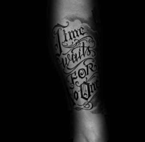 Bold black and grey tattoo with ornate gothic lettering that reads Time Waits for No One.