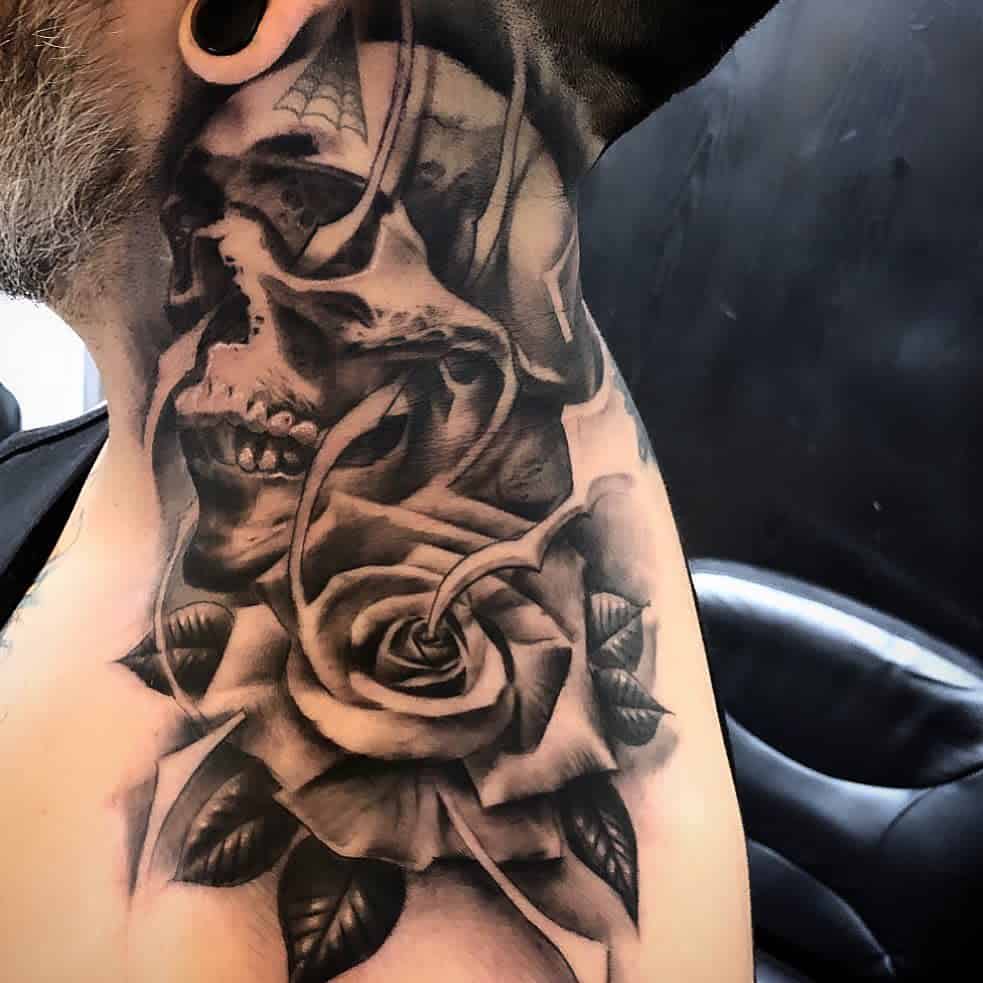 Black and grey neck tattoo of a skull entwined with a detailed rose, featuring deep shading and intricate realism for a bold design.
