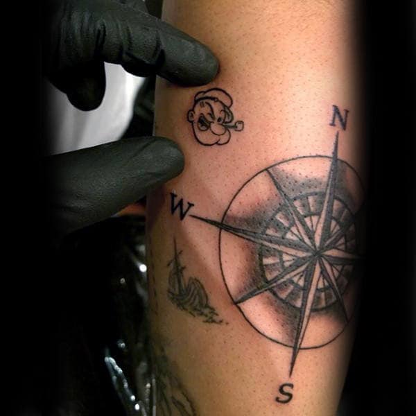 Tiny Small Mens Popeye Portrait Face Tattoo On Arm With Nautical Compass