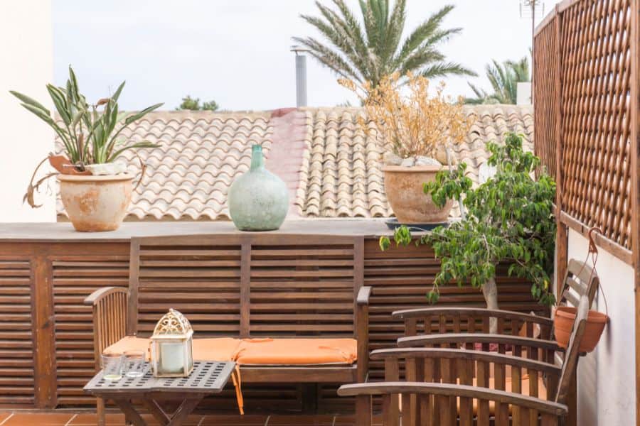 balcony patio with wood table and chairs