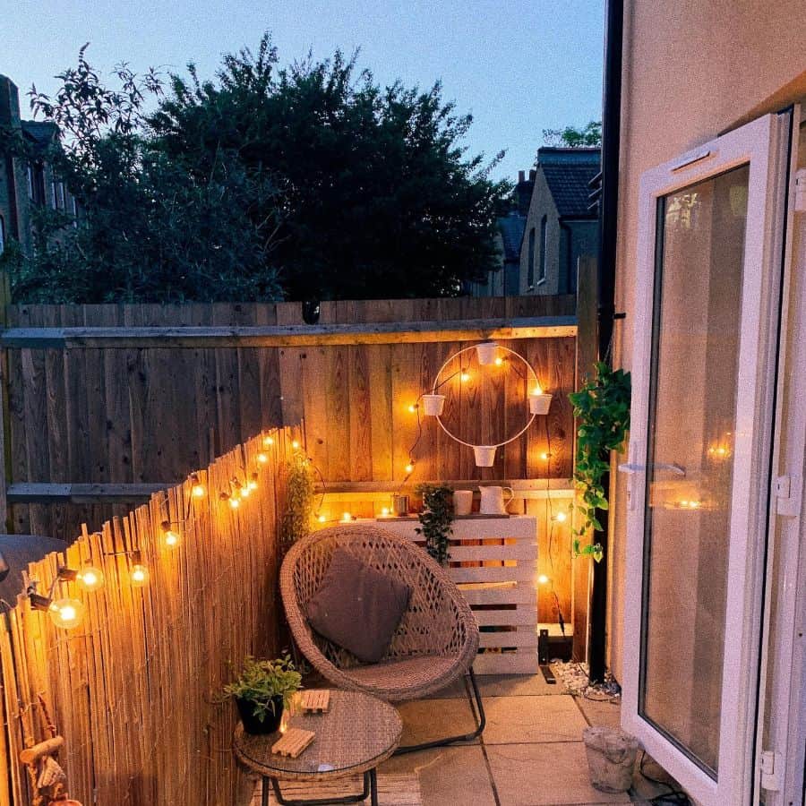 small tiny patio with bamboo privacy fence