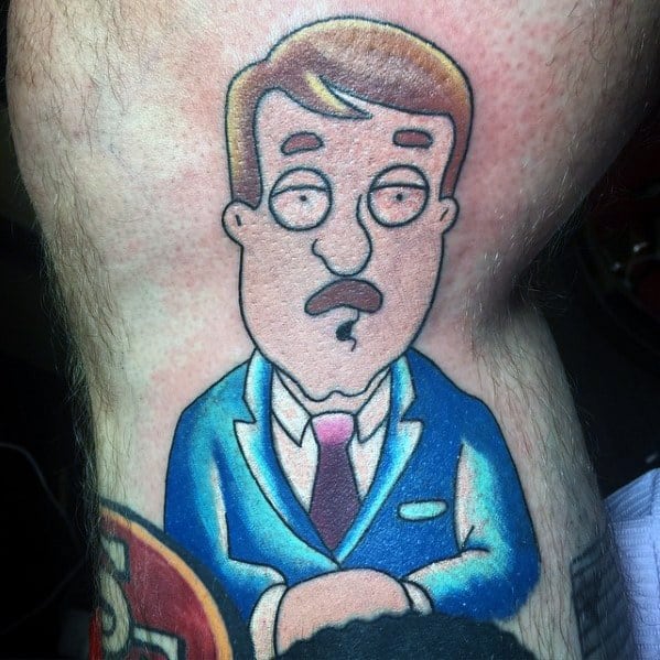 Tattoo of Tom Tucker from *Family Guy*, wearing a blue suit and pink tie, with his signature mustache and serious news anchor expression.