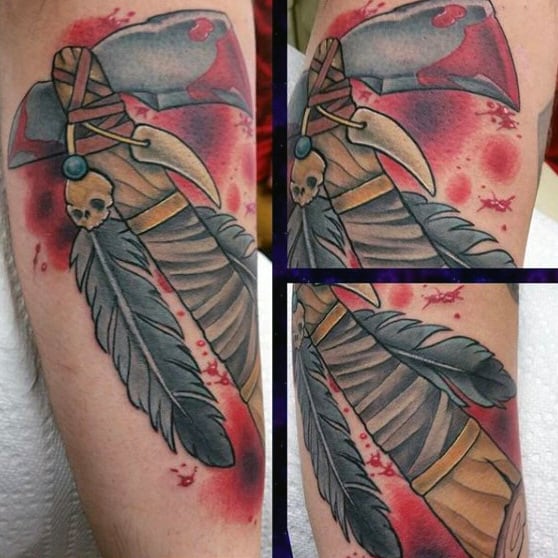 Tomahawk With Skull Tooth And Feather Mens Outer Forearm Tattoo