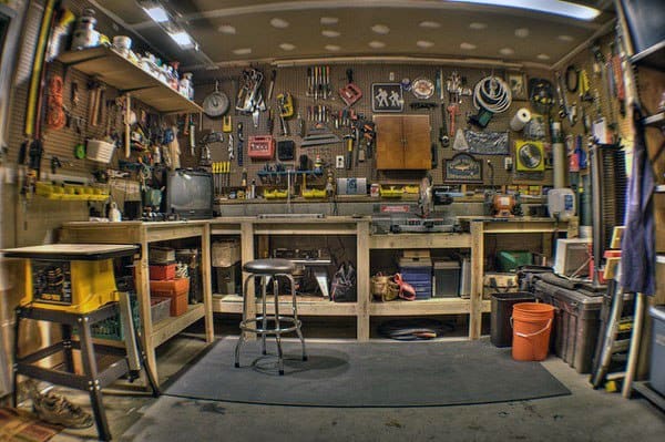 well oragnized tool workshop garage wood workbench and storage