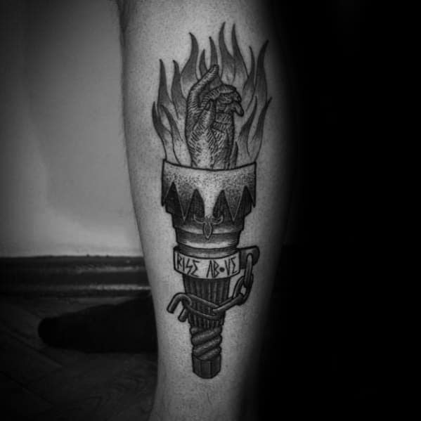 Black and grey torch tattoo with a realistic heart engulfed in flames, rope details around the handle, and engraved Roman numerals.