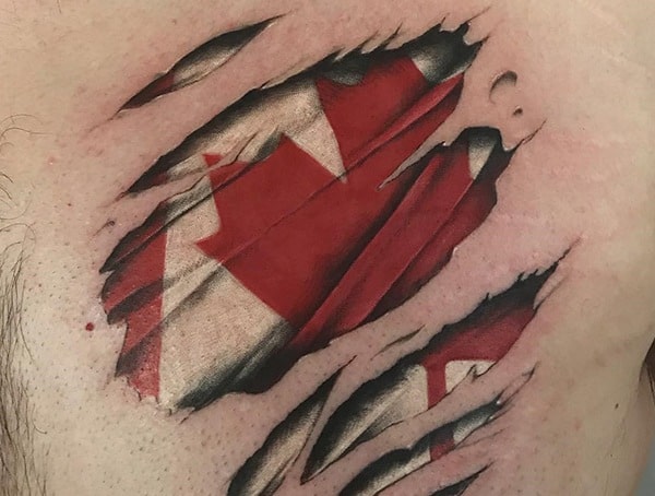 Realistic ripped-skin tattoo revealing a Canadian flag underneath, featuring detailed shading and depth for a 3D torn-flesh effect.