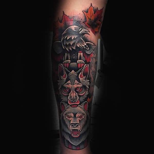 Tattoo of a Japanese wolf, raven, and bear stacked vertically with red maple leaves in the background