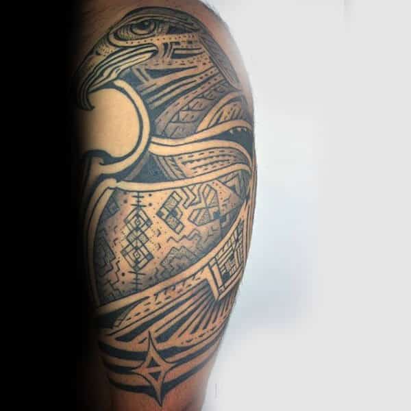 Totem Style Upper Arm Hawk Tattoo For Guys